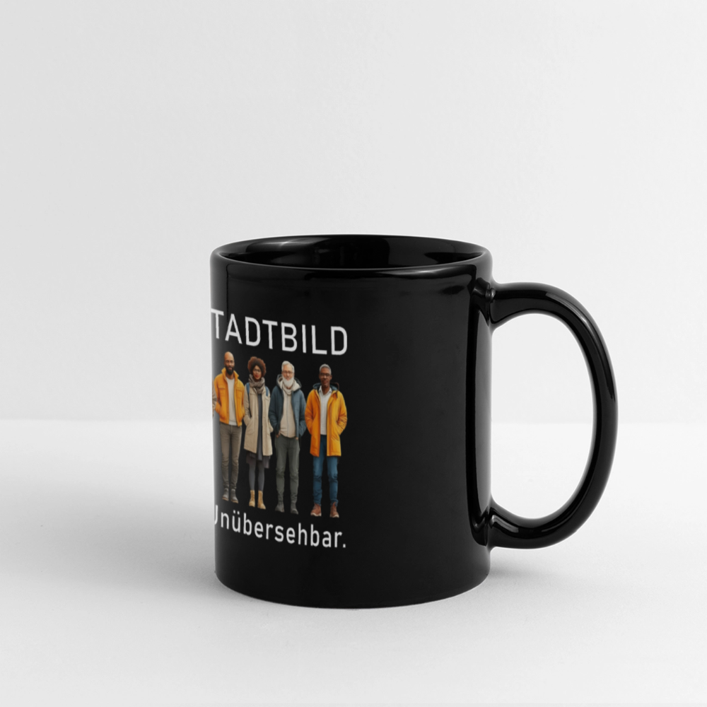 „Schwarze Keramiktasse mit Illustration und Text: Sichtbar. Laut. Unübersehbar.“