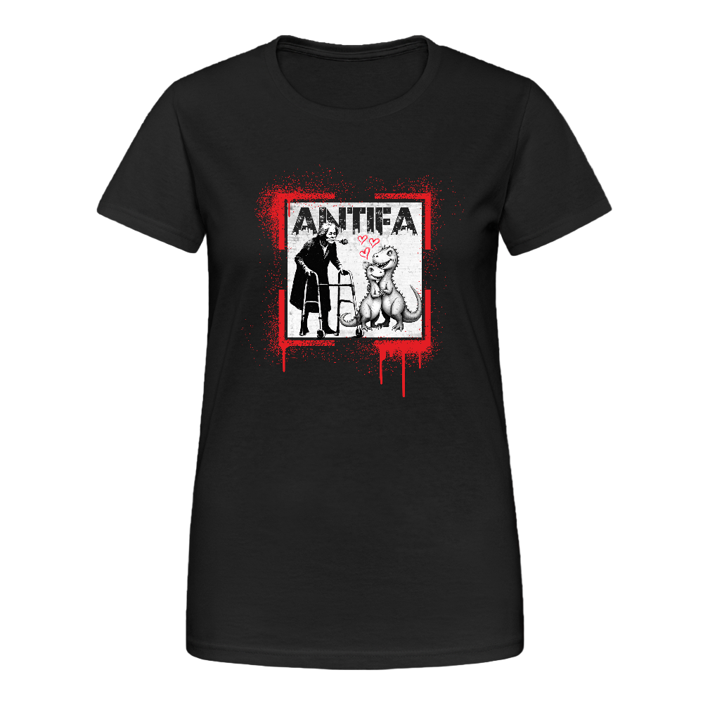 Schwarzes Damen T-Shirt mit grafischem Frontprint: Oben steht „ANTIFA“ in roter Schrift. Darunter zwei stilisierte Figuren – links eine vermummte Person mit Baseballschläger, rechts eine Figur mit Herzsymbol und tierischer Maske. Roter Splatter-Effekt umrahmt das Design. Das Motiv wirkt konfrontativ und symbolträchtig.